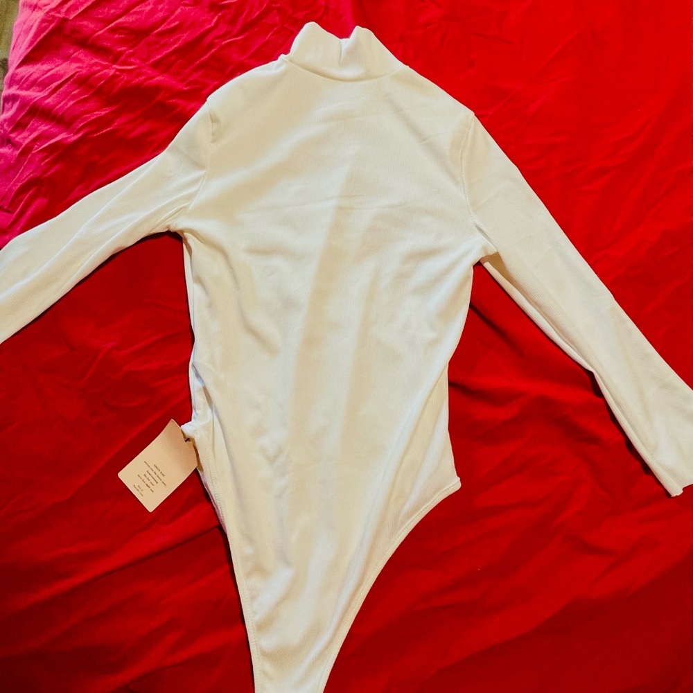 White turtleneck long sleeve bodysuit